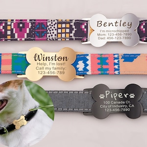 May include: Three dog collar tags with bone shapes. The top tag is silver and says "Bentley I'm microchipped Mom: 123-456-7890 Dad: 456-123-7890". The middle tag is gold and says "Winston Help, I'm lost! Call my family: 123-456-789". The bottom tag is black and says "*Piper* 100 Canada Ct. City of Industry, CA 123-456-7890".
