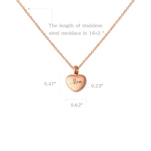 May include: Rose gold stainless steel necklace with a heart pendant that says "Mom" on it. The necklace is 18 inches long and the pendant is 0.62 inches wide.