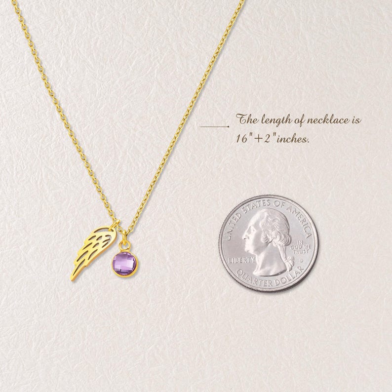 May include: A gold-colored necklace with a pendant featuring a purple gemstone and a wing charm. The necklace is 16" + 2" inches long. A U.S. quarter is next to the necklace for size comparison.