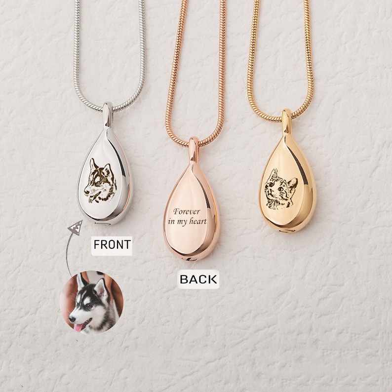 May include: Three silver, rose gold, and gold teardrop-shaped cremation necklaces with engraved pet portraits and the inscription "Forever in my heart" on the back.