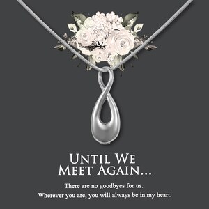 May include: Silver infinity pendant necklace with a floral design. The necklace has a quote that reads "Until we meet again... There are no goodbyes for us. Wherever you are, you will always be in my heart."
