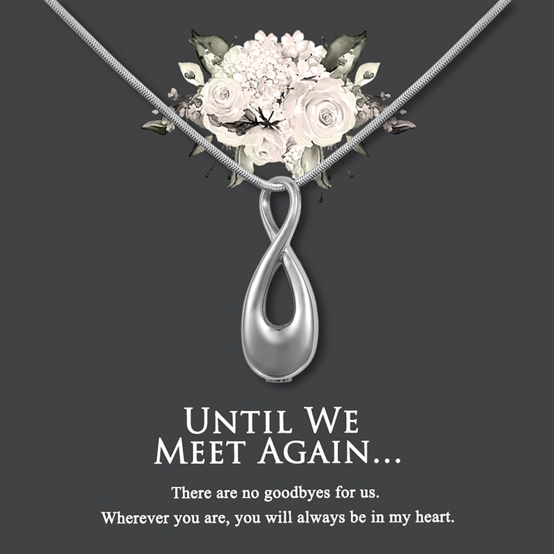 May include: Silver infinity pendant necklace with a floral design. The necklace has a quote that reads "Until we meet again... There are no goodbyes for us. Wherever you are, you will always be in my heart."