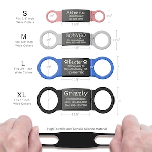 May include: Four silicone pet collar tags in sizes S, M, L, and XL, featuring pink, gray, blue, and black bands with central black plates engraved with names and contact info. Dimensions are labeled in inches, showing fits for 3/8 to 1 inch collars.