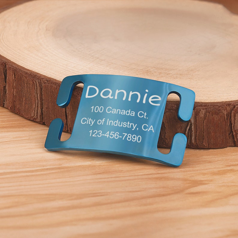 May include: Blue metal dog tag with engraved text: "Dannie, 100 Canada Ct., City of Industry, CA, 123-456-7890".