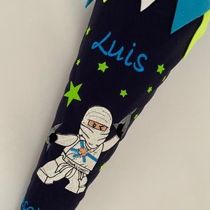 Cono escolar/cono de azúcar tela Ninja incl. cartón en blanco 70 cm ST7194