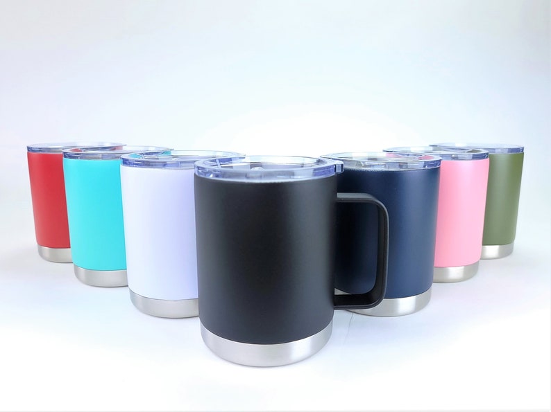 May include: A collection of insulated travel mugs in various colors, including red, teal, white, black, navy, pink, and olive green. Each mug has a silver base and a clear lid. The mugs are designed to keep beverages hot or cold.