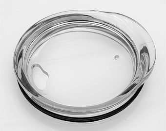 May include: Clear glass lid with a black rubber seal around the edge. The lid has a small handle on the side.