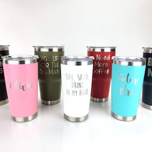 May include: Seven stainless steel tumblers with various colors and engraved text. The text includes "Hard Work Pays", "Big Up For The Big Man", "Sun, Sand, Drink In My Hand", "Need More Coffee", "Future Mrs", "Olivia", and "Boss Man".