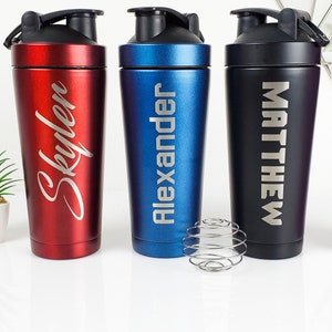 May include: Four stainless steel shaker bottles with personalized names: Skyler, Alexander, Matthew, and Michelle. The bottles are red, blue, black, and pink.