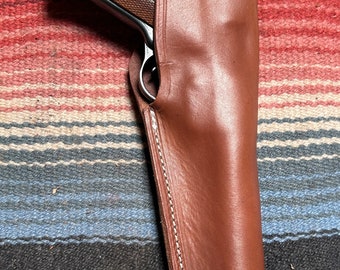 Funda de cuero con cierre de pulgar para Ruger Mark I, II, III y IV. Compatible con cañones Mk y estándar de 4,75, 5,5, 6 y 6,88.