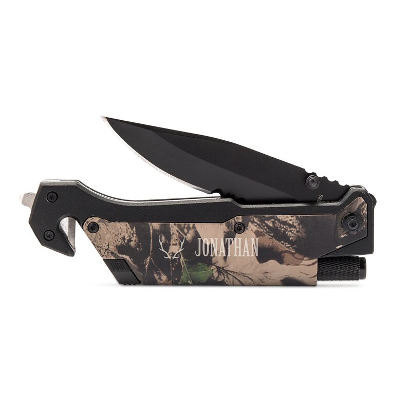 May include: A black and camo multi-tool knife with a blade, a seatbelt cutter, and a flashlight. The knife is personalized with the name "JONATHAN".