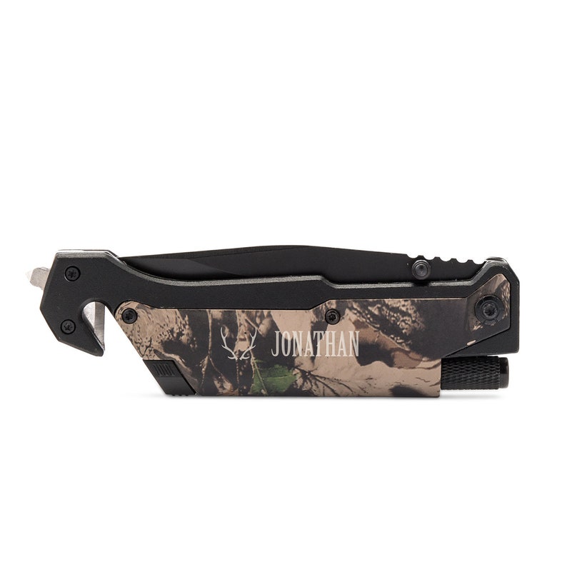 May include: A black and camo multi-tool knife with a safety feature and a flashlight. The knife is personalized with the name "JONATHAN" and a deer head logo.