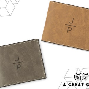 May include: Two leather wallets with a stitched edge. One wallet is brown and the other is gray. Both wallets have the initials "J/P" engraved on the front. The text "GG A GREAT GIFT!" is visible in the bottom right corner of the image.