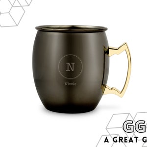 May include: A black and gold personalized copper mug with the initial "N" and the name "Nicole" engraved on the front.