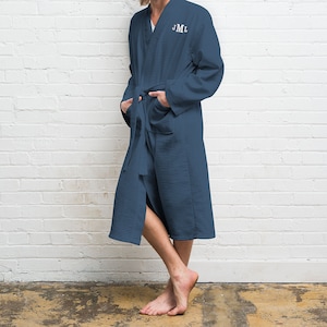 May include: A blue waffle weave robe with a white embroidered monogram "JML".