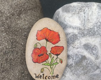 Poppies painted on stone "Welcome"