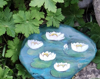 Water lilies painted on stone