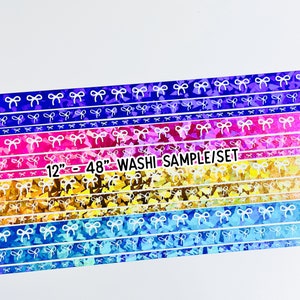 May include: A set of 12" wide washi tape samples featuring a rainbow of colors with a white bow pattern. The text "12" - 48" WASHI SAMPLE/SET" is printed on the tape.