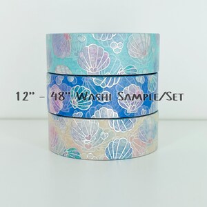 May include: Three rolls of iridescent washi tape with a seashell pattern. The tape is 12 inches long and 48 inches total. The tape is blue, pink, and white.
