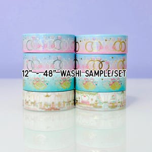 May include: A stack of washi tape rolls with various designs. The rolls feature patterns of wedding rings, floral arrangements, and wedding scenes. The text "12"-48" WASI SAMPLE/SET" is printed on the rolls. The background is a gradient of light blue and purple.