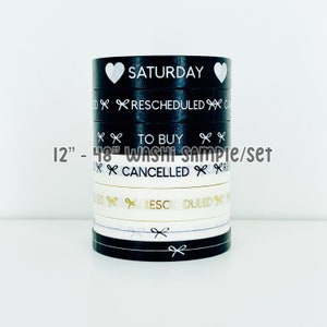 May include: A set of 12-inch washi tape samples featuring black and white designs with gold accents. The tape designs include "Saturday", "Rescheduled", "To Buy", and "Cancelled".
