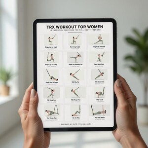 May include: A tablet displaying a TRX workout routine for full body strength. The screen shows 15 essential exercises with illustrations. The text at the top reads "TRX WORKOUT FOR WOMEN". The tablet is held by a person.
