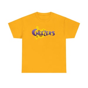 May include: A yellow t-shirt with a purple and yellow graphic of a cheese wedge with the word "Weezers" on it.