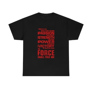 May include: Black t-shirt with red text. The text reads "Peace is a lie, there is only passion. Passion, I gain strength. Strength, I gain power. Power, I gain victory. Victory, my chains are broken. The Force shall free me."