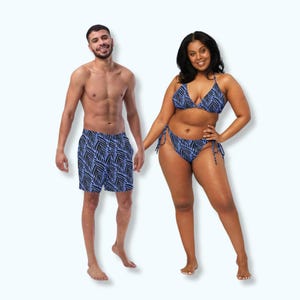 May include: A matching swimwear set featuring a blue and black leaf pattern. The set includes a bikini top and bottom, and a pair of swim trunks. The swimwear is designed for a beach or pool setting.