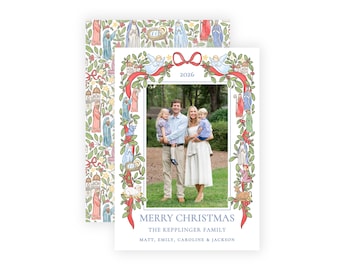 May include: A rectangular Christmas card featuring a central photo of a family framed by a watercolor border of nativity figures, greenery, and a red ribbon. The text reads 2026, MERRY CHRISTMAS, THE KEPPLINGER FAMILY, MATT, EMILY, CAROLINE & JACKSON.