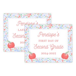 May include: Two printable signs with a floral border and red apples. The top sign says "Penelope's Last Day of Second Grade 2022". The bottom sign says "Penelope's First Day of Second Grade 2024-2025".