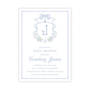 May include: Baby shower invitation with a light blue border and a central design featuring a bow, floral elements, and the letter "J". The invitation text reads "Join us for a Baby Shower" and honors Courtney Jensen.