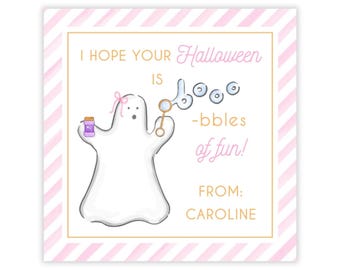 May include: A square gift tag with a pink and white diagonal striped border. It features a white ghost with a pink bow, holding a purple bubble bottle and a wand blowing bubbles. Text reads: I HOPE YOUR Halloween IS BOOO-bbles of fun! FROM: CAROLINE.