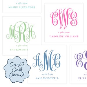 May include: White square gift tags with elegant monogram designs in various colors, including green, pink, and blue. Each tag features a unique monogram and the phrase "a gift from" followed by a name. A blue graphic states "Over 60 Color Options!"