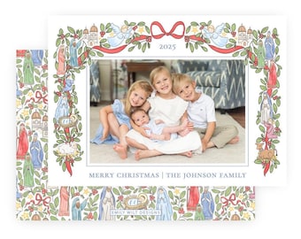 May include: A rectangular Christmas card featuring a central photograph of three children, framed by a watercolor border of nativity figures, greenery, and red ribbons. The text reads 2025, MERRY CHRISTMAS | THE JOHNSON FAMILY, and EMILY WILT DESIGNS.