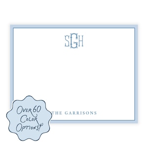 May include: A light blue stationery set with a white interior and a light blue border. The top right corner features a monogram in light blue, with the text "THE GARRISONS" at the bottom. A light blue sticker reads "Over 60 Color Options!"