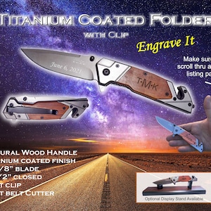 May include: A titanium-coated folding knife with a natural wood handle and belt clip. The blade is 3 3/8 inches long and the closed length is 4 1/2 inches. The knife has the text "Engrave It" and "June 6, 2021".