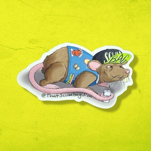 May include: A sticker depicting a cartoon rat wearing a blue vest with cartoon patches and a black hat with the word "SCUMBAG" in green. The rat has a pink tail and is holding a small object. The text "@ThatScumbagJim" is at the bottom.