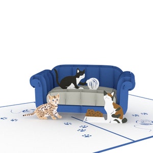 Cat Trouble pop up card: 3 playful cats cavort by a blue couch. This version has a bengal kitten.