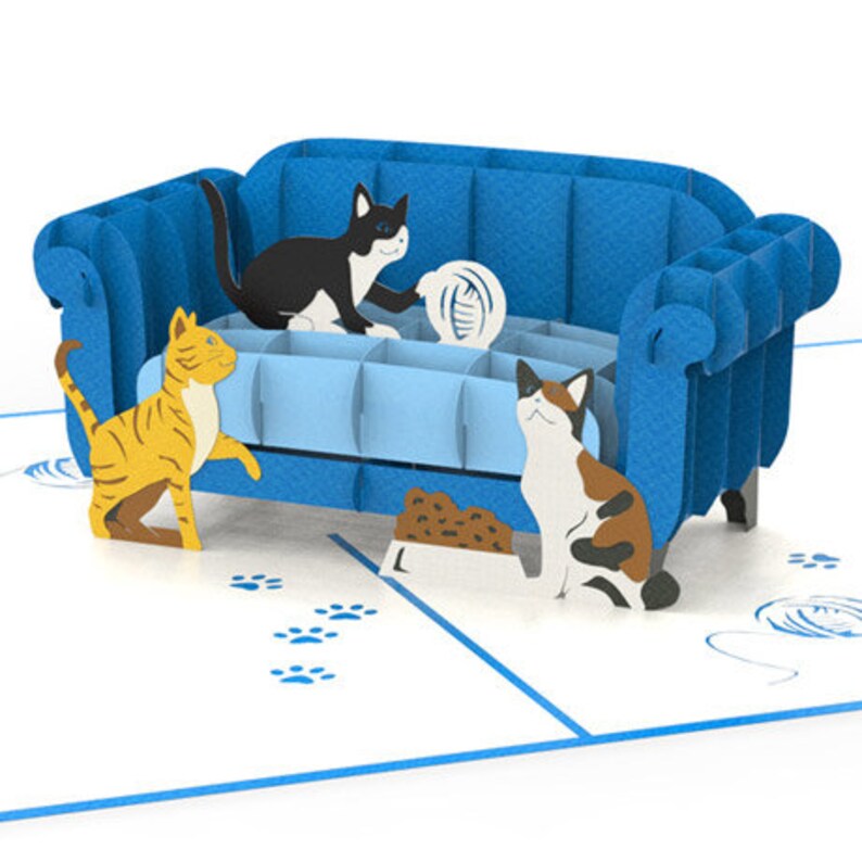 Cat Trouble pop up card: 3 playful cats cavort by a blue couch. They're ready to create mischief.