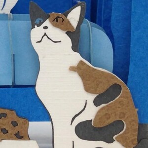closeup of cat in pop up card.