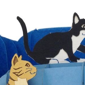 closeup of cats in pop up card.