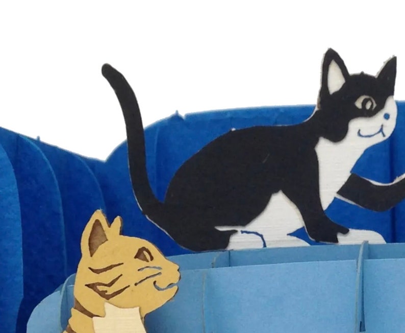 closeup of cats in pop up card.
