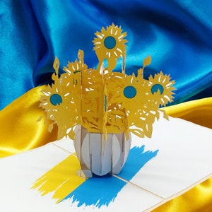 Tarjeta de girasol emergente SOLIDARIDAD DE UCRANIA que apoya a Ucrania - Bandera azul + amarilla de Ucrania - Girasoles de Ucrania 3D - Resistencia, paz y unidad
