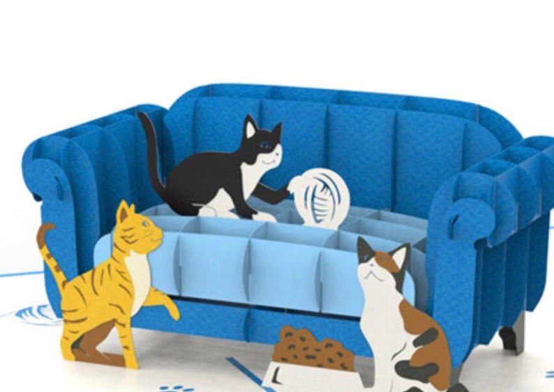 Cat Trouble! Pop up card: 3 playful cats cavort by a blue couch. Ready to create mischief.