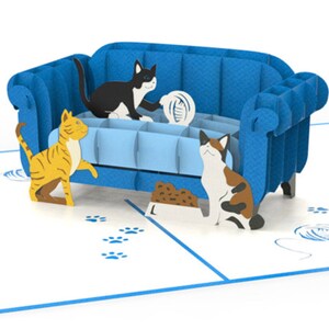 Cat Trouble pop up card: 3 playful cats cavort by a blue couch. They are ready to create mischief.