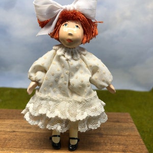 Little girl doll with red hair