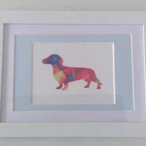 Neon sausage dog picture. A framed printed image of a Dachshund framed.