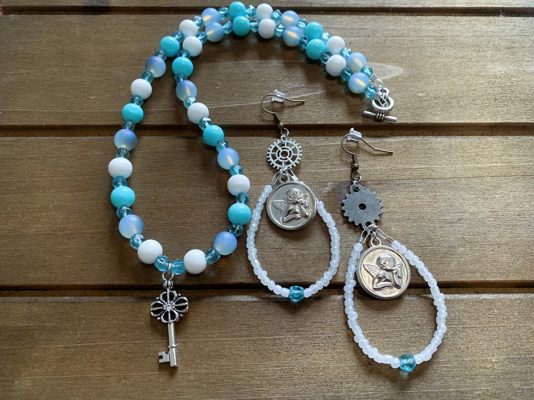 heavenly-realms-jewelry-set-blue-key-necklace-angel-earrings-set