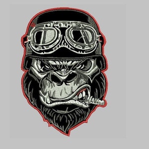 May include: An embroidered patch featuring a gorilla wearing a black helmet with goggles and a cigarette in its mouth. The patch has a red outline.